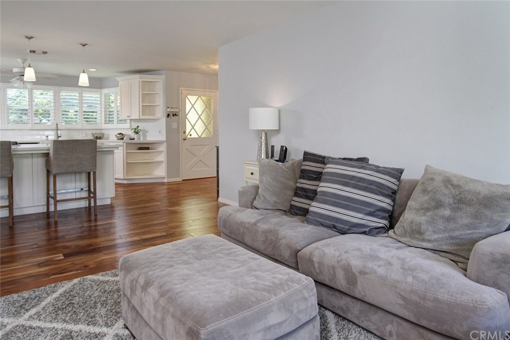 3745 Landfair Road Pasadena, CA 91107 - Photo 13 of 25 a living room with couches and kitchen view with wooden floor