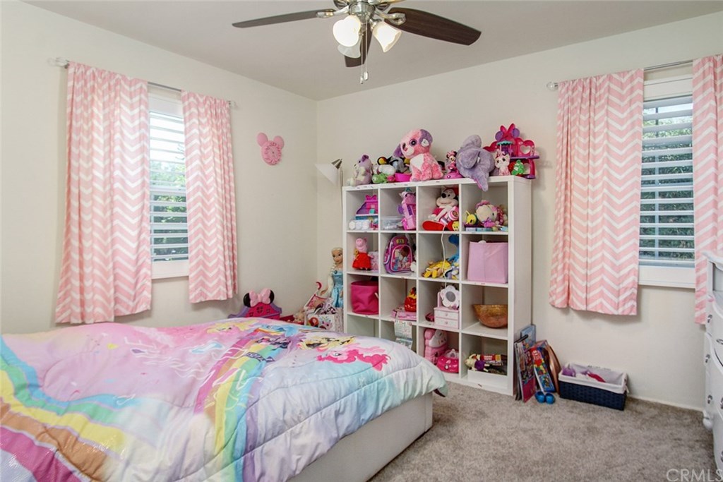 3745 Landfair Road Pasadena, CA 91107 - Photo 18 of 25 a bedroom with a bed and a chandelier