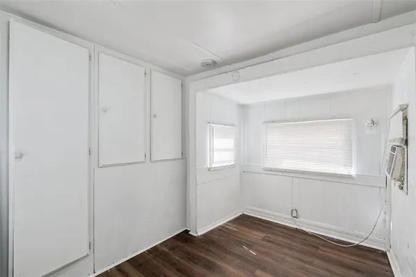 a view of hallway with wooden floor