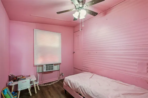 a backyard of a house with a tree