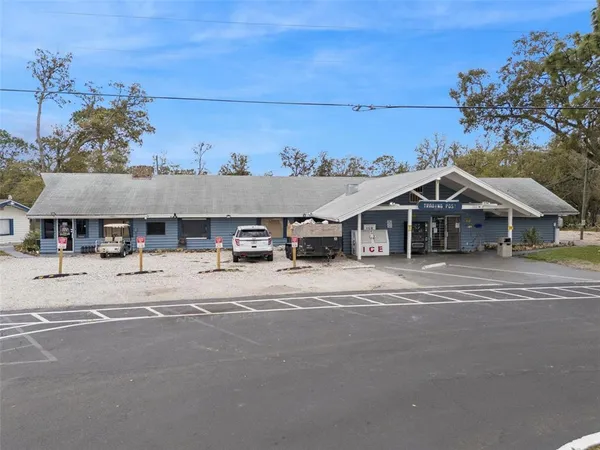 an aerial view of a house with a ocean view