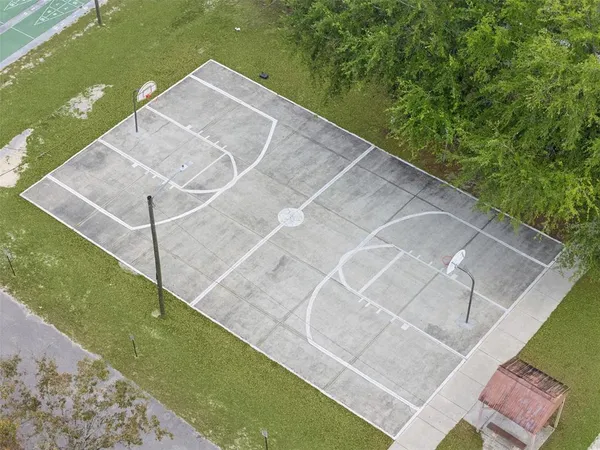 a view of a swimming pool with a yard