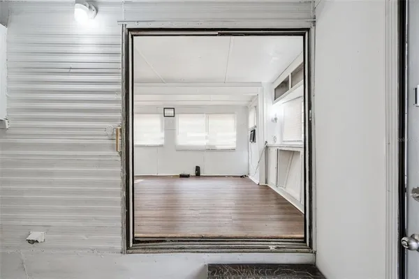 a view of an empty room and window