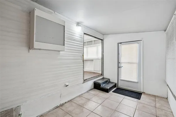 a view of a kitchen with wooden floor and cabinet