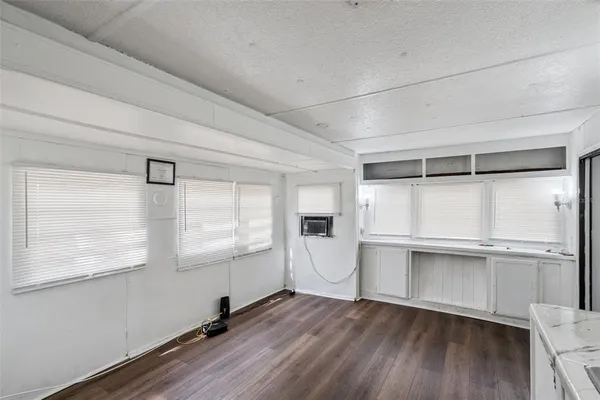 a kitchen that has a sink and cabinets