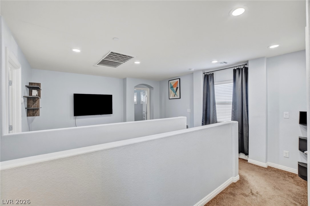 48 Jasmine Point Street Henderson, NV 89074 - Photo 30 of 62 A versatile open loft area provides ample space for relaxation or recreation.