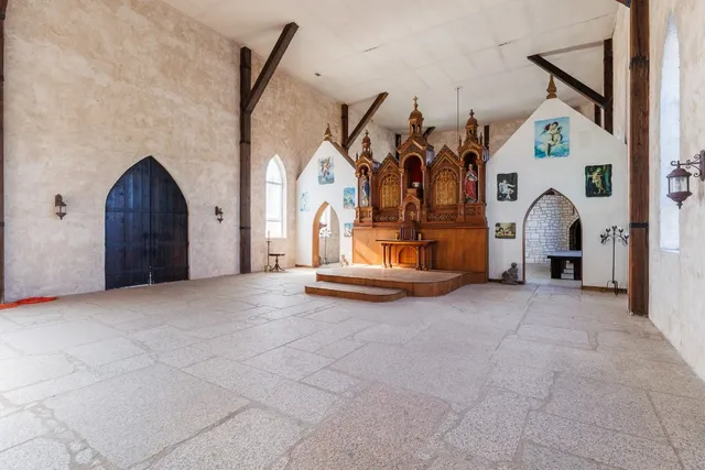 a view of a house with entryway and wooden floor