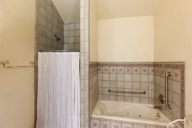 a bedroom with furniture and wooden floor