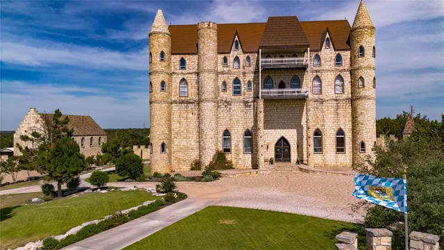 front view of a building with a garden