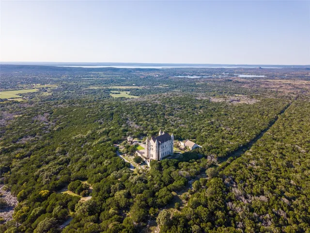an aerial view of residential house and outdoor space