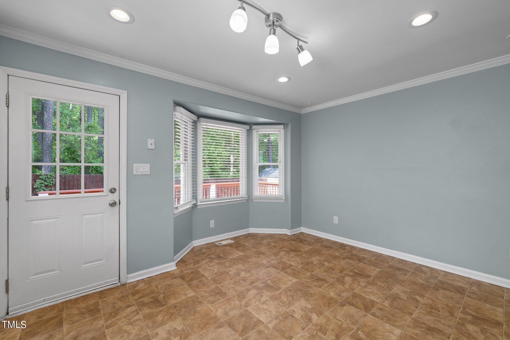 4209 Timberbrook Drive Raleigh, NC 27616 - Photo 13 of 39 an empty room with windows and closet