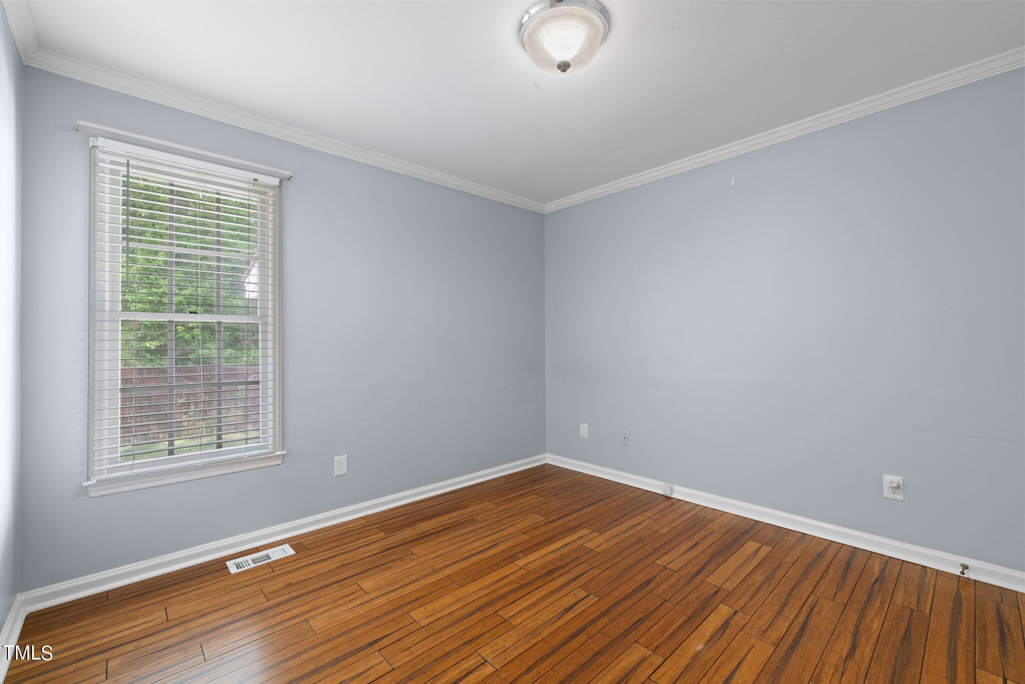 4209 Timberbrook Drive Raleigh, NC 27616 - Photo 18 of 39 wooden floor in an empty room with a window