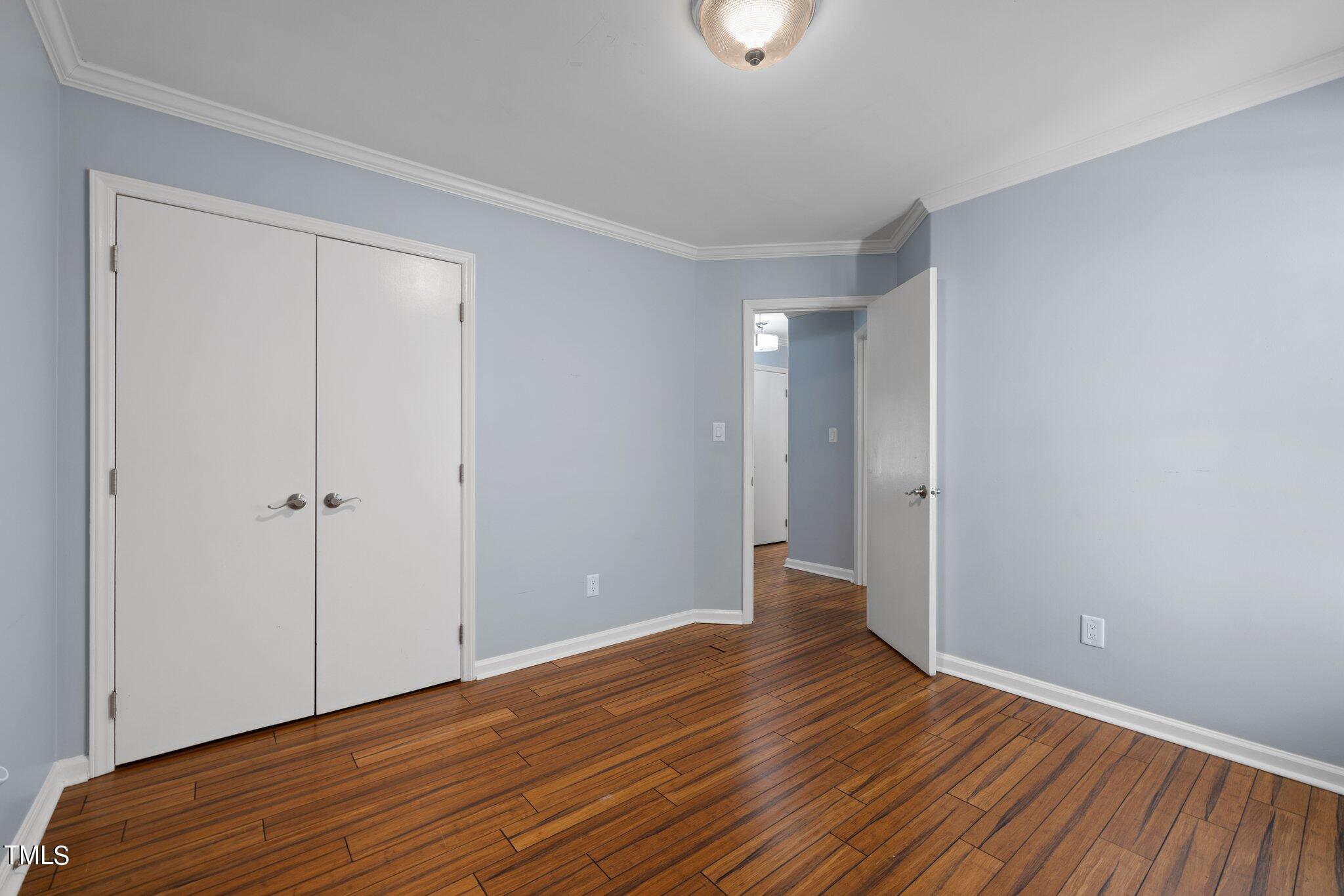 4209 Timberbrook Drive Raleigh, NC 27616 - Photo 19 of 39 a view of an empty room with wooden floor