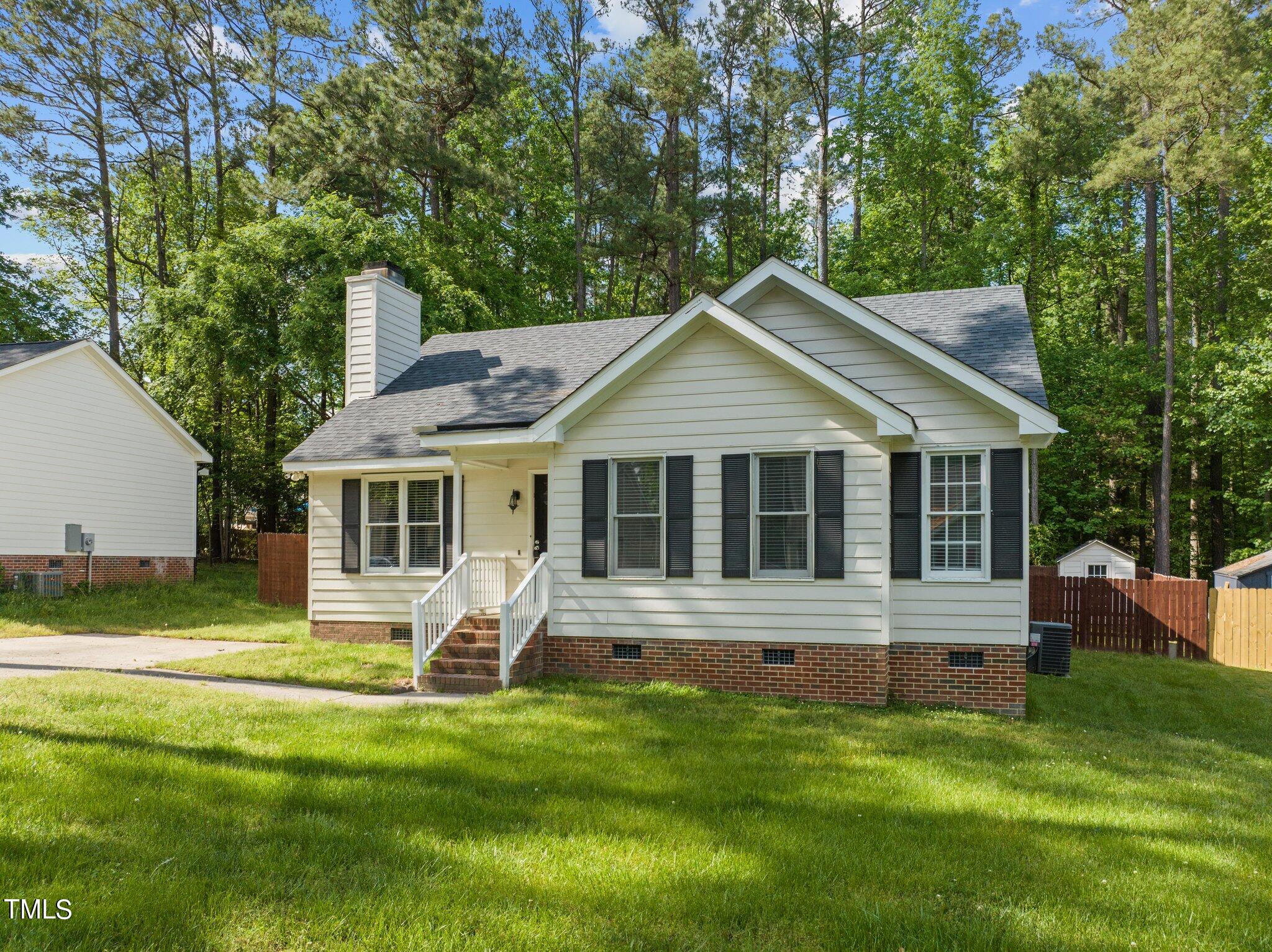 4209 Timberbrook Drive Raleigh, NC 27616 - Photo 2 of 39 a front view of a house with a yard