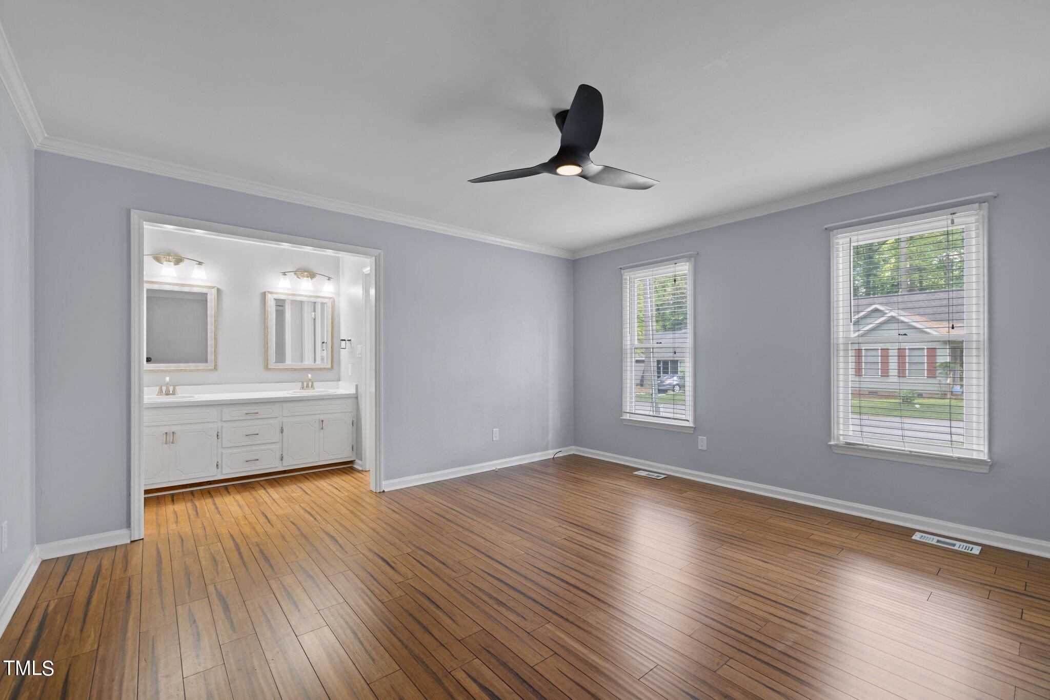 4209 Timberbrook Drive Raleigh, NC 27616 - Photo 22 of 39 a view of an empty room with window and wooden floor