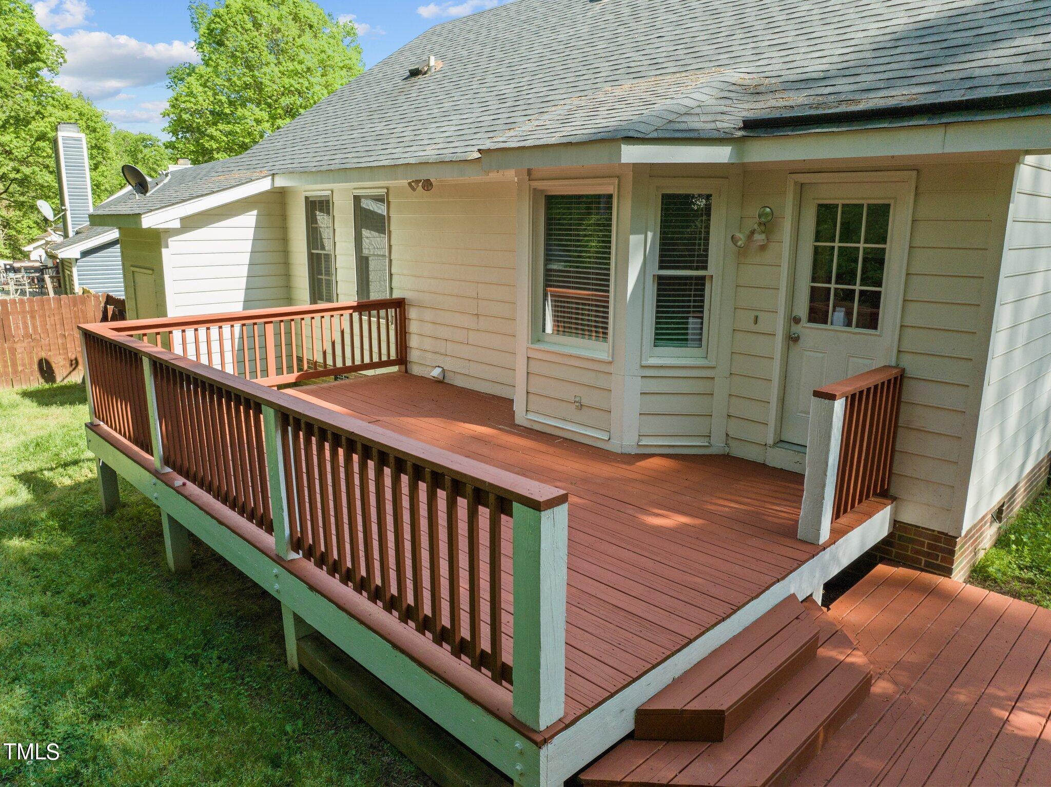 4209 Timberbrook Drive Raleigh, NC 27616 - Photo 30 of 39 a view of a wooden deck and a backyard