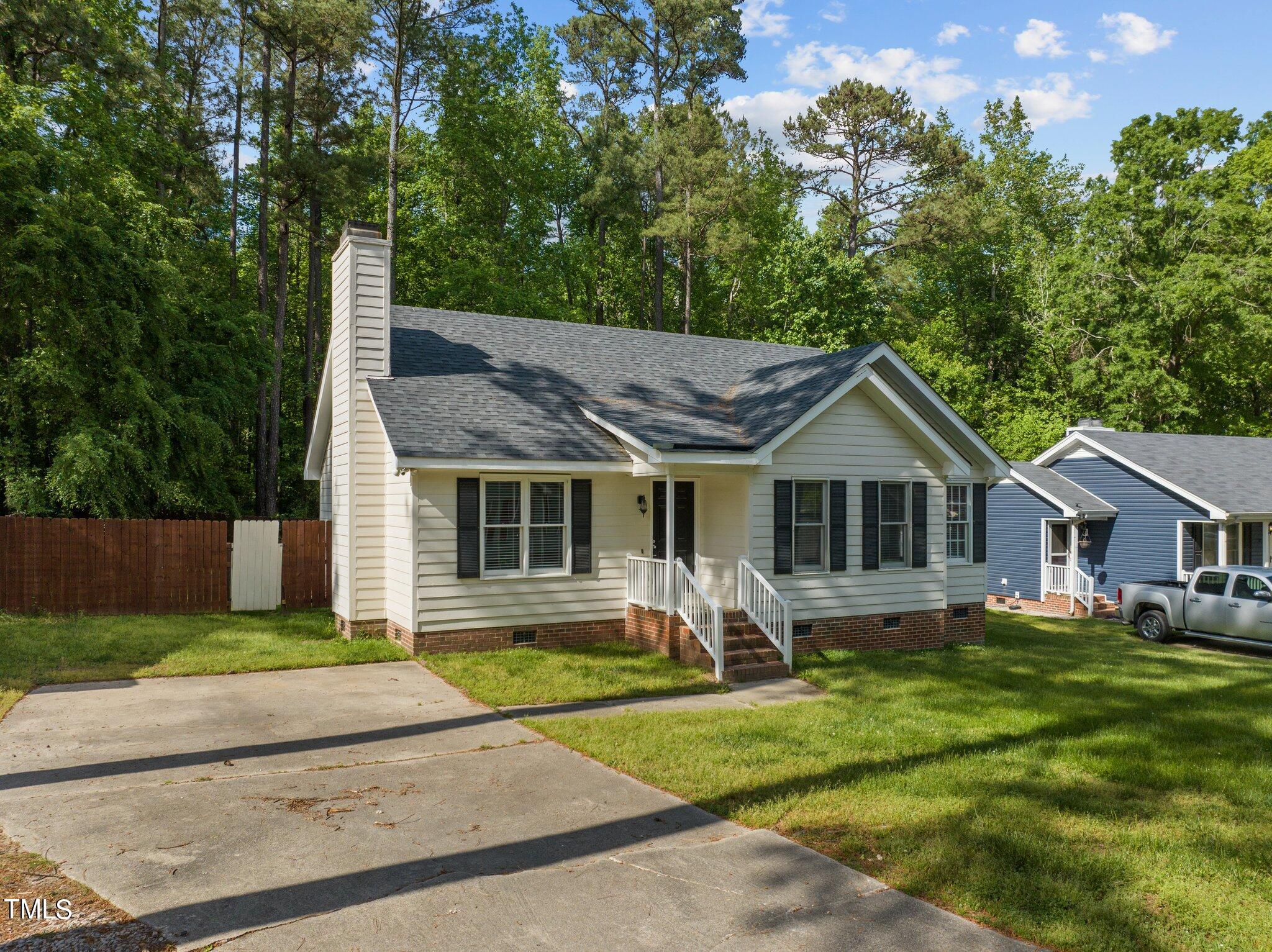 4209 Timberbrook Drive Raleigh, NC 27616 - Photo 3 of 39 a front view of house with yard and green space