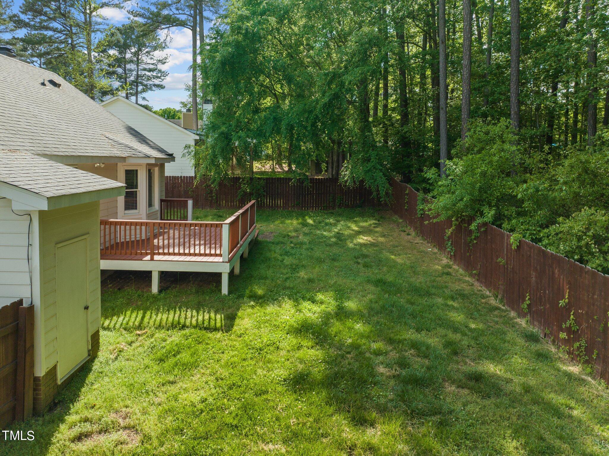 4209 Timberbrook Drive Raleigh, NC 27616 - Photo 33 of 39 a backyard of a house with yard and trampoline