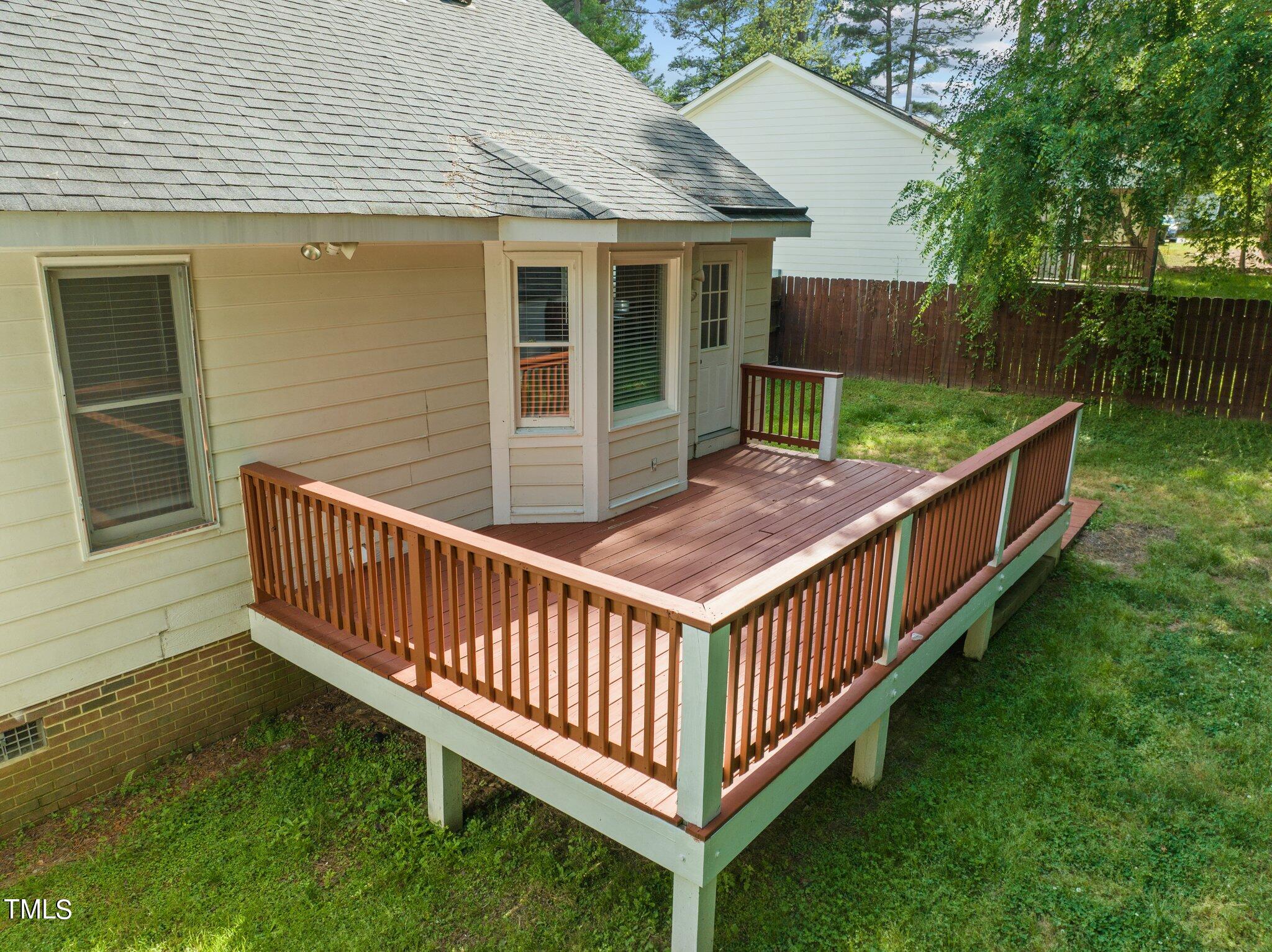 4209 Timberbrook Drive Raleigh, NC 27616 - Photo 34 of 39 a view of a house with a yard and deck