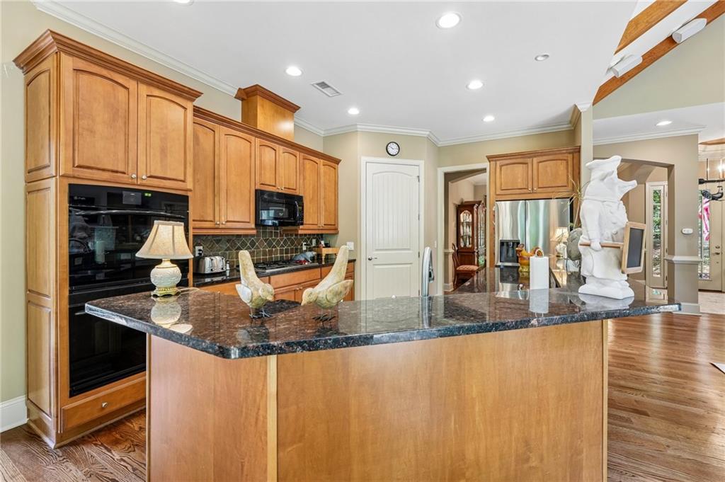 189 Red Trillium Ridge Big Canoe, GA 30143 - Photo 25 of 98 a kitchen with stainless steel appliances granite countertop a sink a stove and a microwave