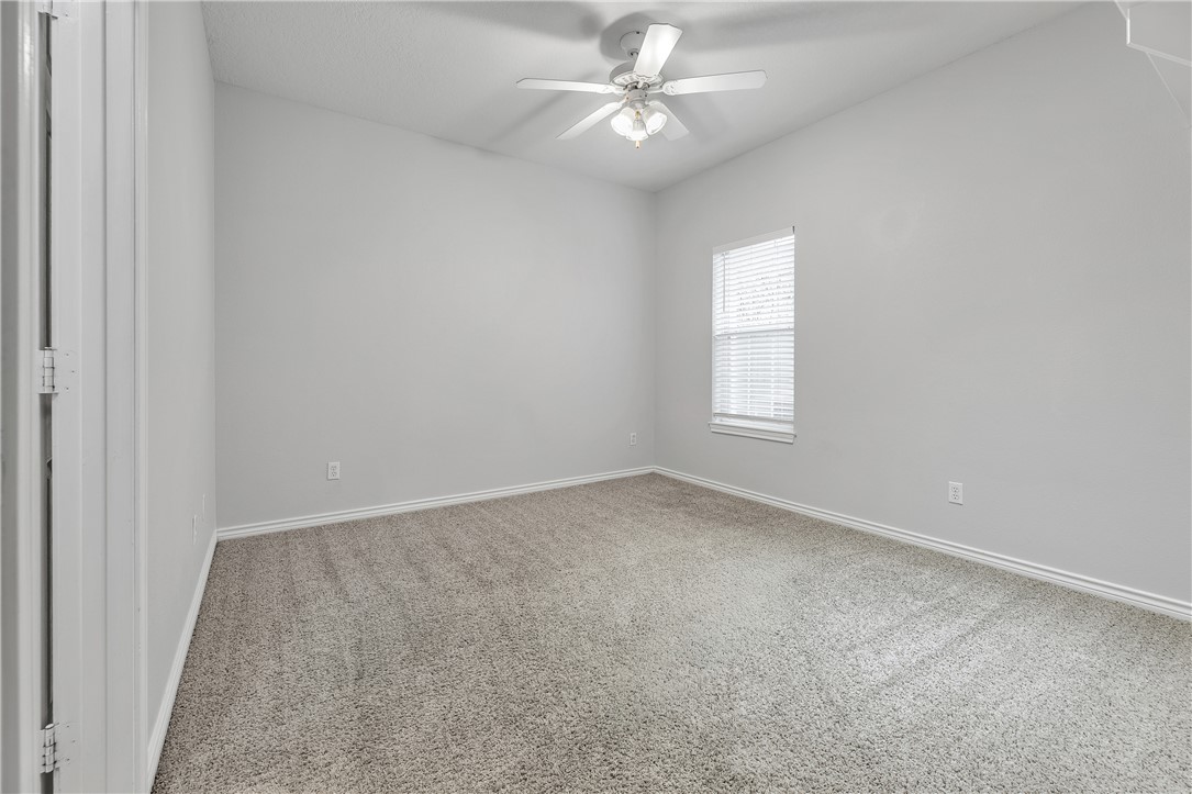 204 Fraternity Row College Station, TX 77845 - Photo 11 of 21 an empty room with a window and a fan