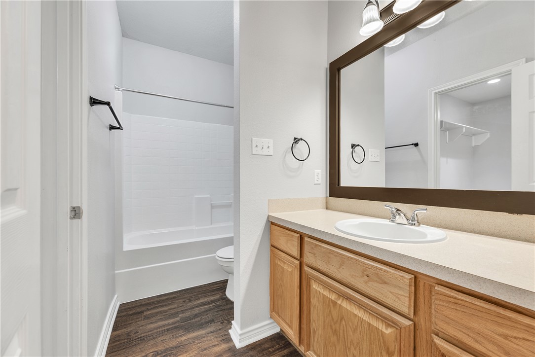 204 Fraternity Row College Station, TX 77845 - Photo 13 of 21 a bathroom with a sink and a mirror