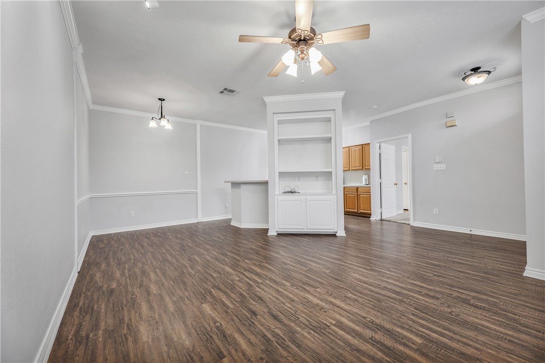 204 Fraternity Row College Station, TX 77845 - Photo 3 of 21 a view of empty room with wooden floor and ceiling fan