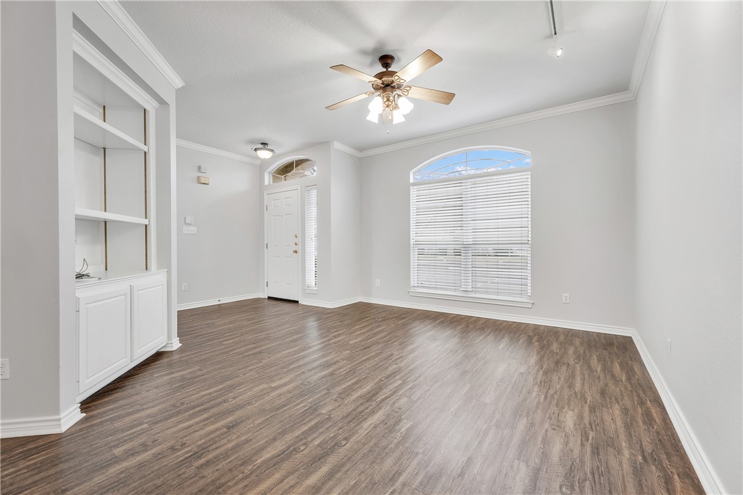 204 Fraternity Row College Station, TX 77845 - Photo 4 of 21 wooden floor in an empty room with a window