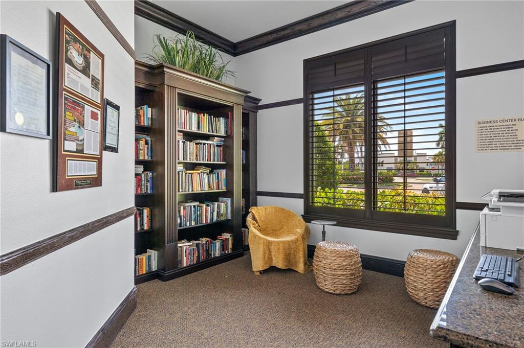 12940 Positano Circle, Unit 204 Naples, FL 34105 - Photo 31 of 39 a room with furniture and a large window