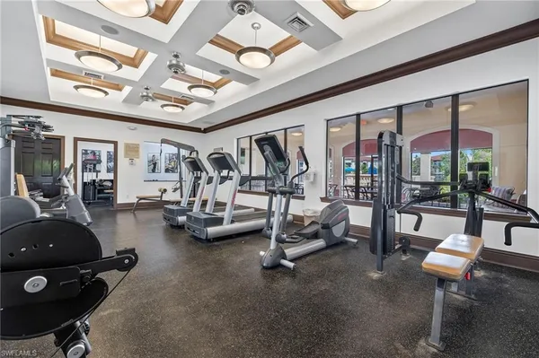 a room with furniture and gym equipment