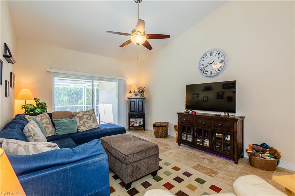 102 Cedar Crest Court Naples, FL 34113 - Photo 2 of 15 a living room with furniture and a flat screen tv
