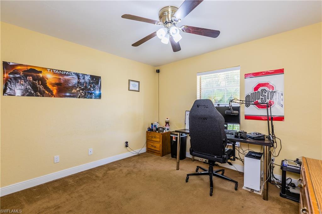 102 Cedar Crest Court Naples, FL 34113 - Photo 8 of 15 a workspace with furniture and ceiling fan