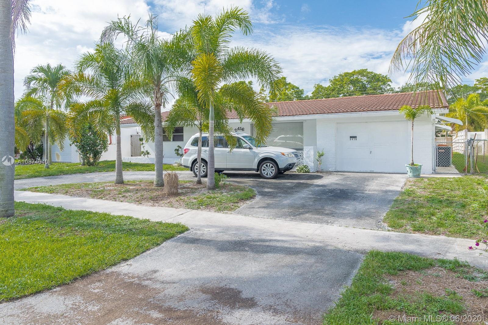 5416 Jefferson Street Hollywood, FL 33021 - Photo 1 of 70 a view of a park with palm trees