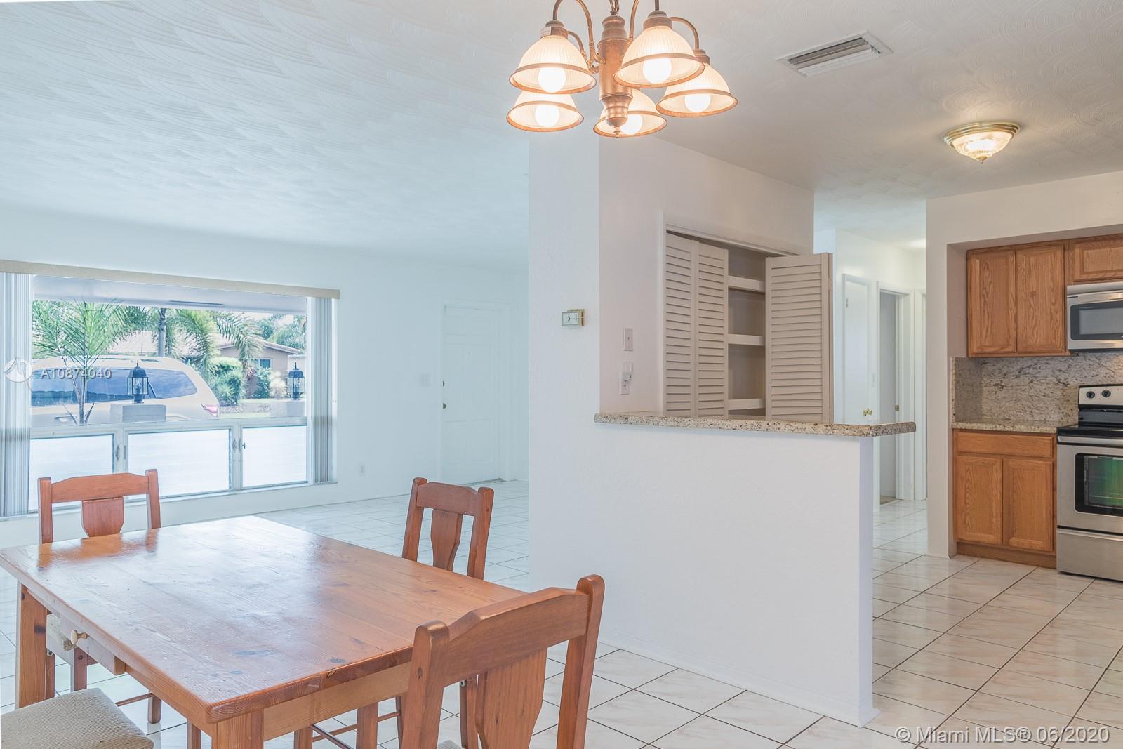 5416 Jefferson Street Hollywood, FL 33021 - Photo 19 of 70 a view of a dining room with furniture window and outside view