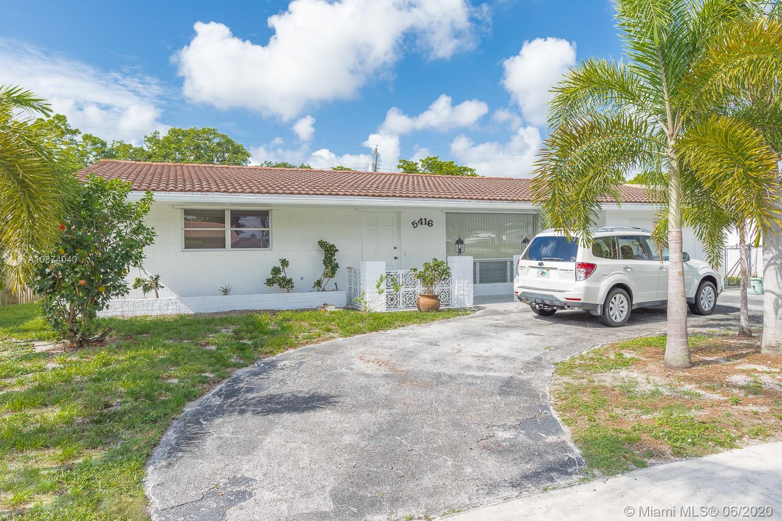 5416 Jefferson Street Hollywood, FL 33021 - Photo 2 of 70 a view of a car parked in front of a house