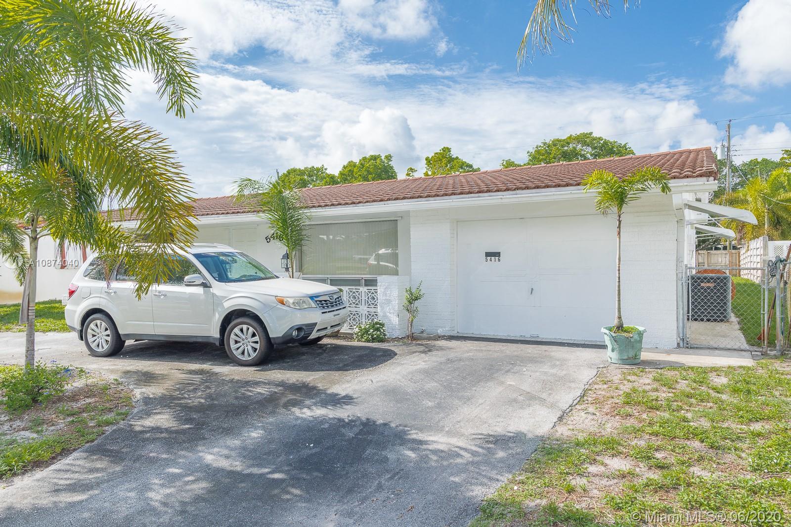 5416 Jefferson Street Hollywood, FL 33021 - Photo 3 of 70 a view of a car in front of a house
