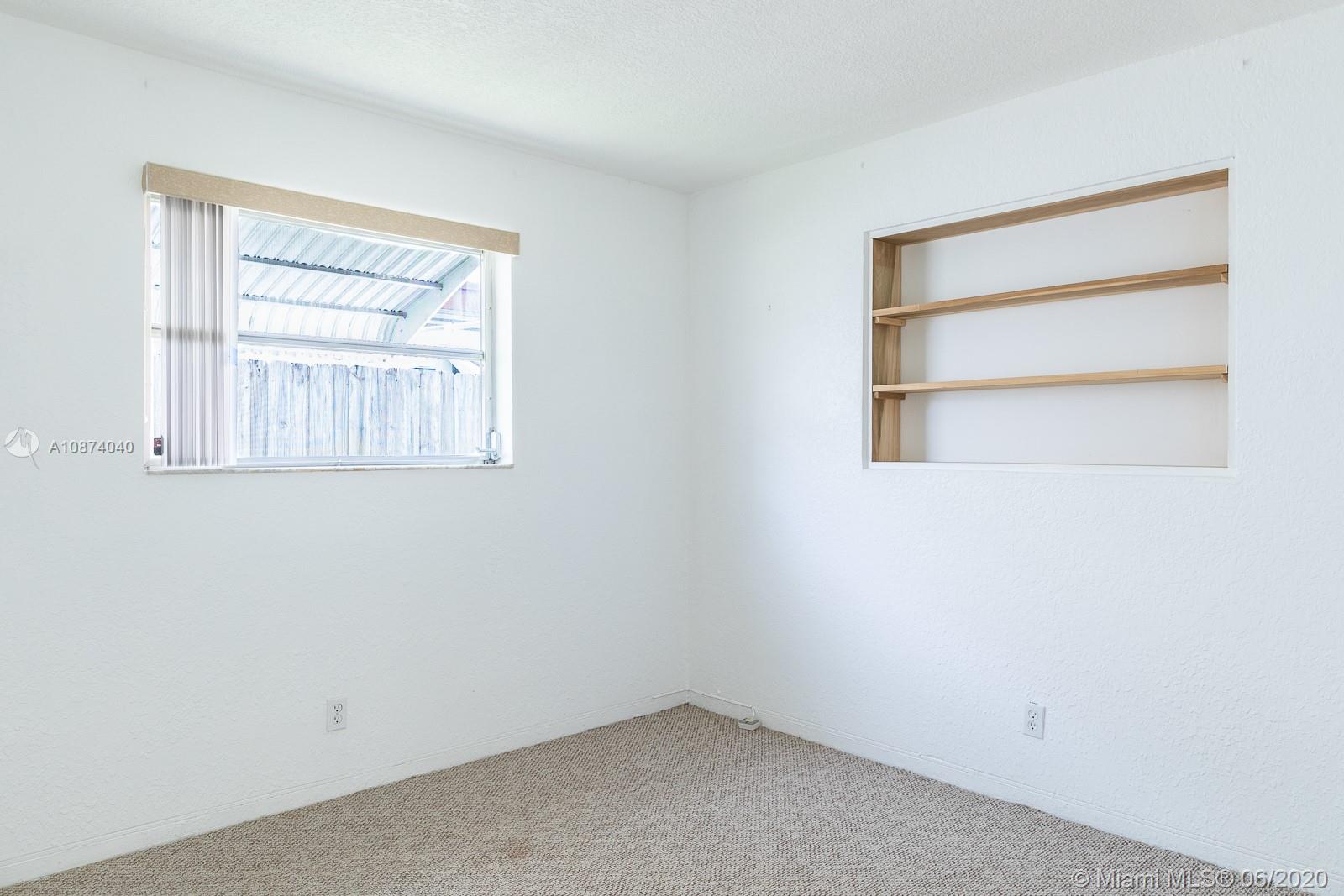 5416 Jefferson Street Hollywood, FL 33021 - Photo 37 of 70 an empty room with a window