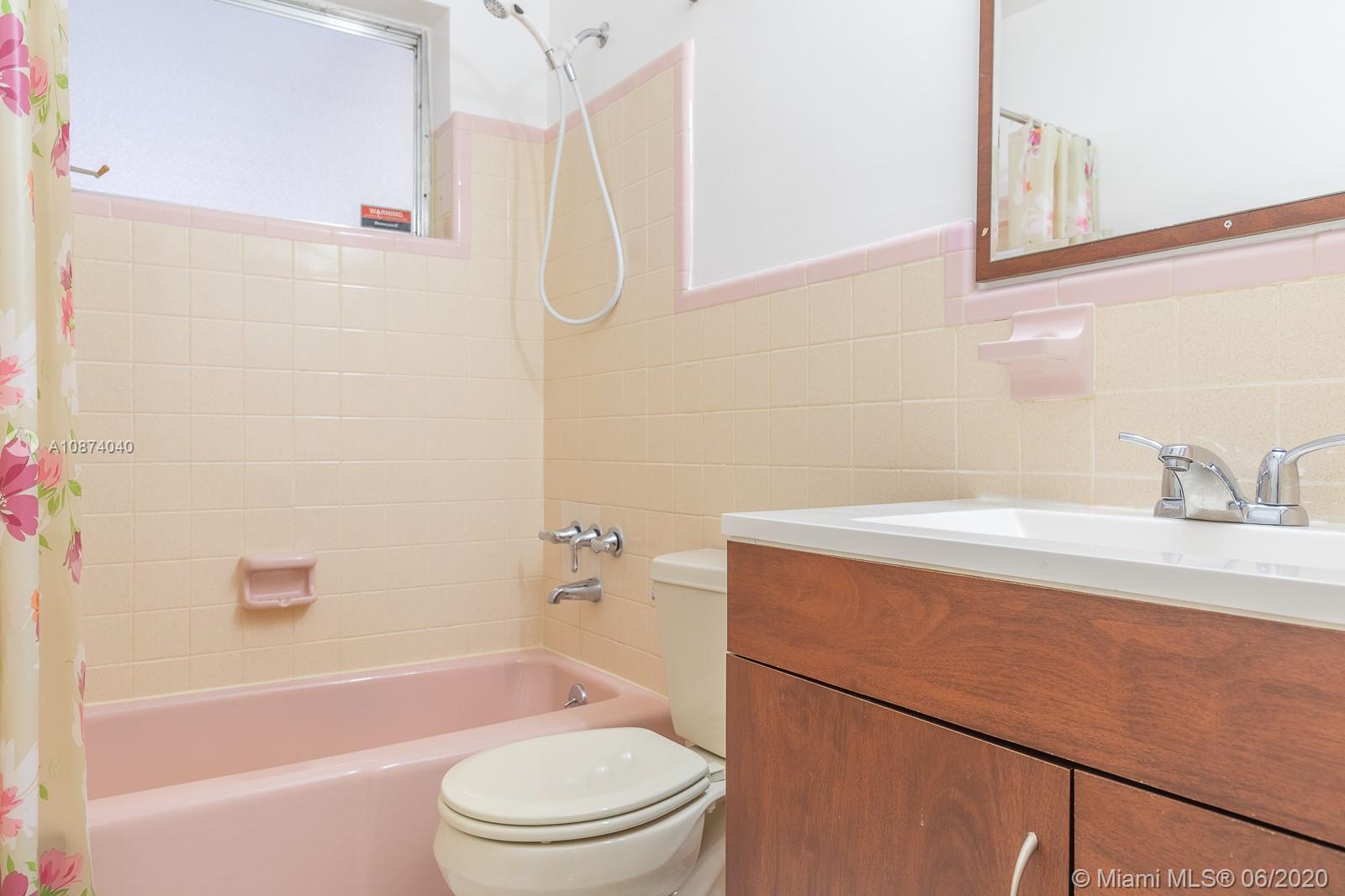 5416 Jefferson Street Hollywood, FL 33021 - Photo 42 of 70 a bathroom with a sink a toilet and shower