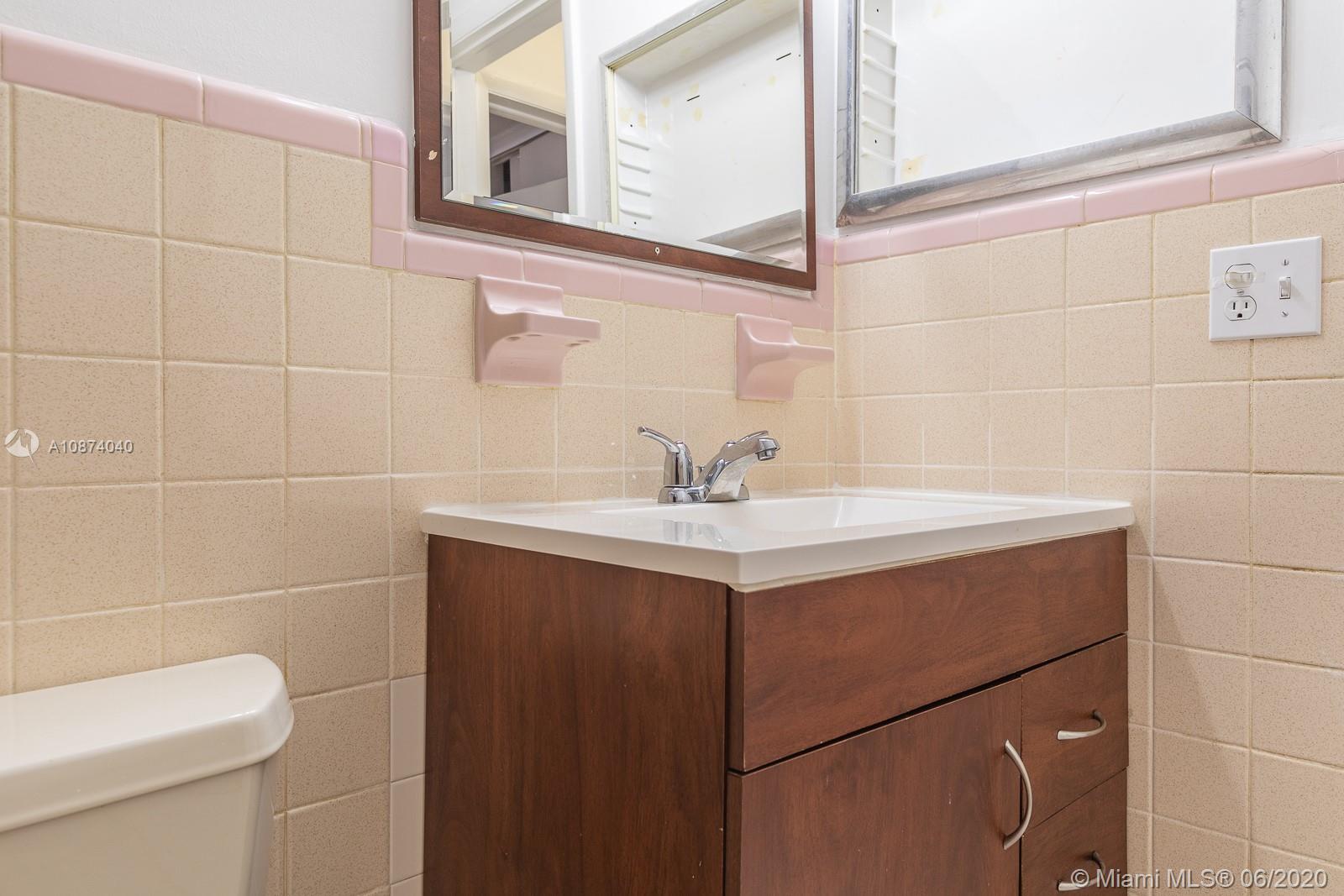 5416 Jefferson Street Hollywood, FL 33021 - Photo 43 of 70 a bathroom with a sink and a toilet
