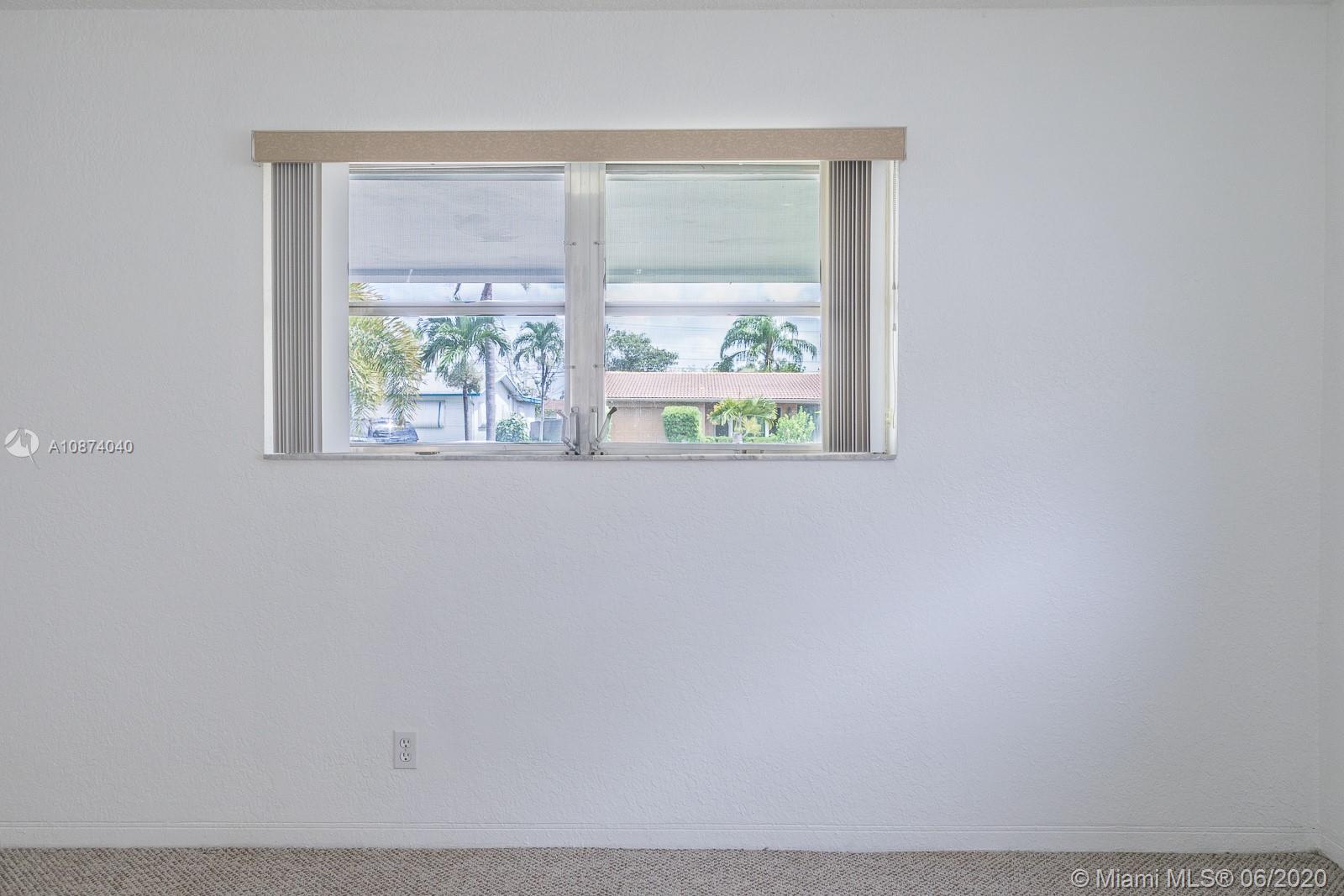 5416 Jefferson Street Hollywood, FL 33021 - Photo 48 of 70 a close up of a wall with a window