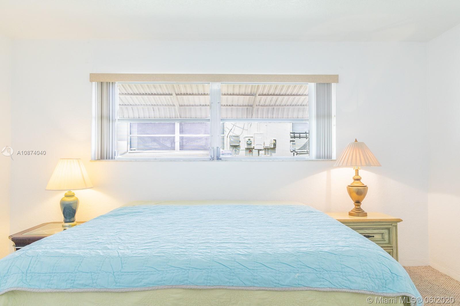 5416 Jefferson Street Hollywood, FL 33021 - Photo 53 of 70 a bedroom with a bed and window