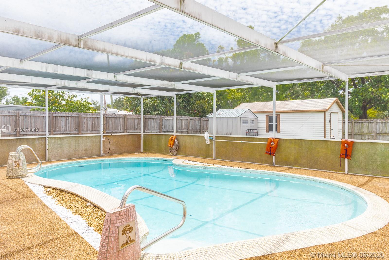 5416 Jefferson Street Hollywood, FL 33021 - Photo 58 of 70 a view of a backyard with a swimming pool