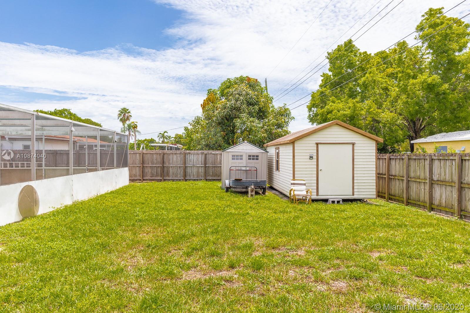 5416 Jefferson Street Hollywood, FL 33021 - Photo 66 of 70 a view of a backyard with a garden and deck