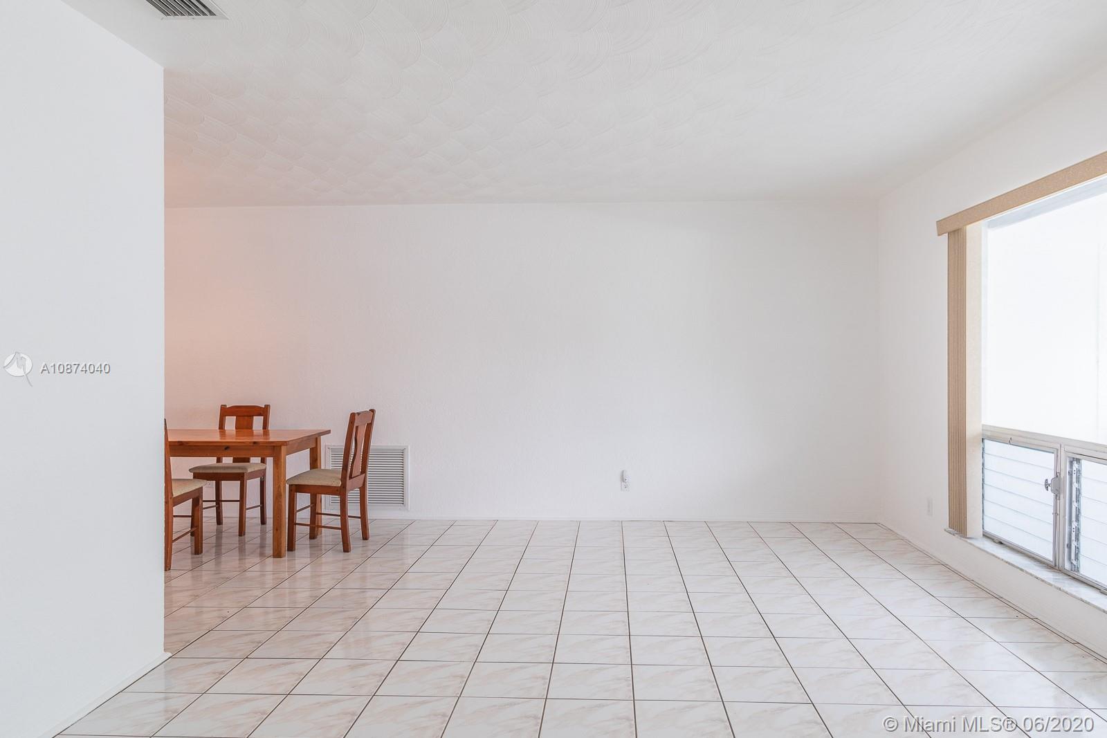 5416 Jefferson Street Hollywood, FL 33021 - Photo 10 of 70 a view of a room with a lounge chair