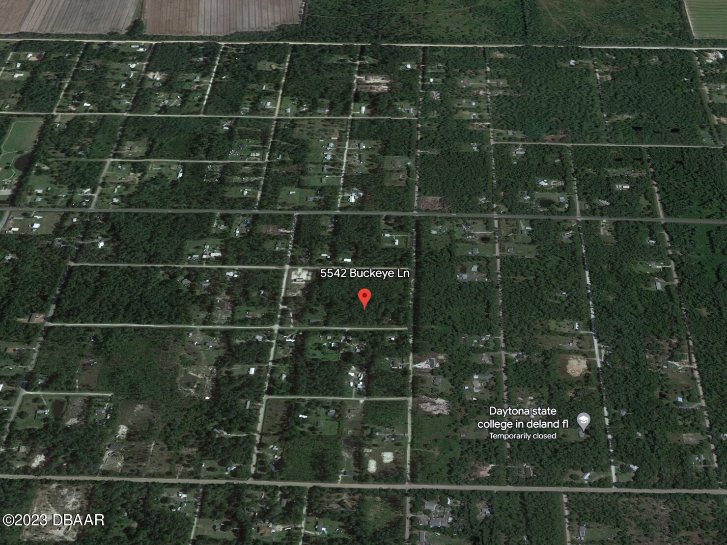 5542 Buckeye Lane Bunnell, FL 32110 - Photo 7 of 8 a bathroom with a glass shower door