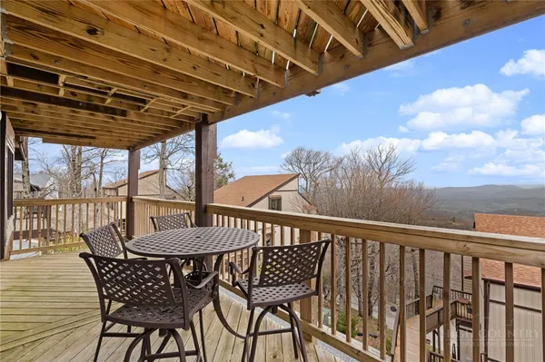 a view of a chairs and table in the patio