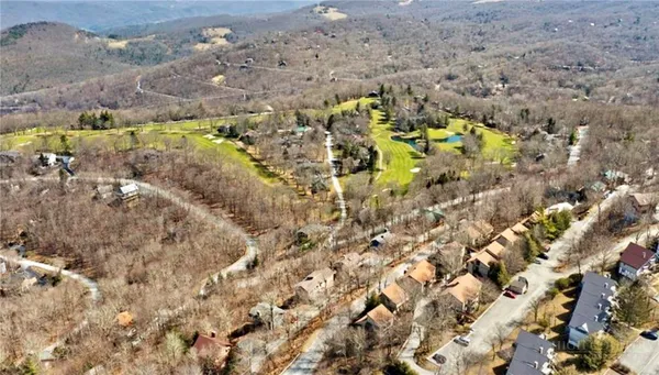 a aerial view of residential houses with swimming pool
