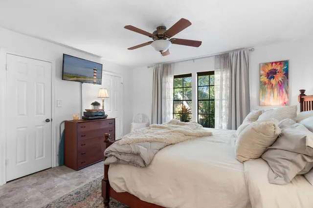 a bedroom with a bed and a couch