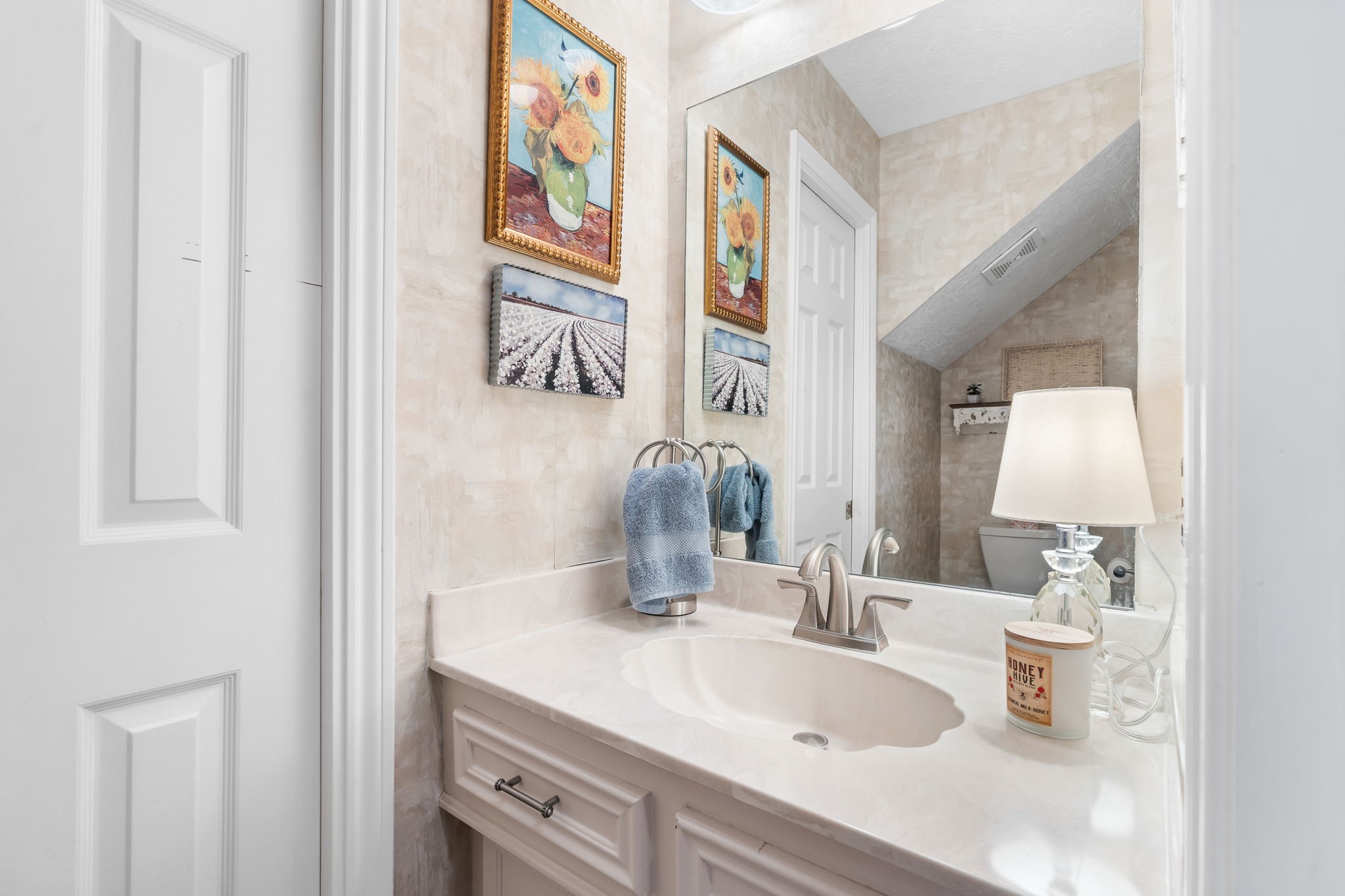 6971 Breezy Point Willis, TX 77318 - Photo 19 of 49 a bathroom with mirror sink and vanity