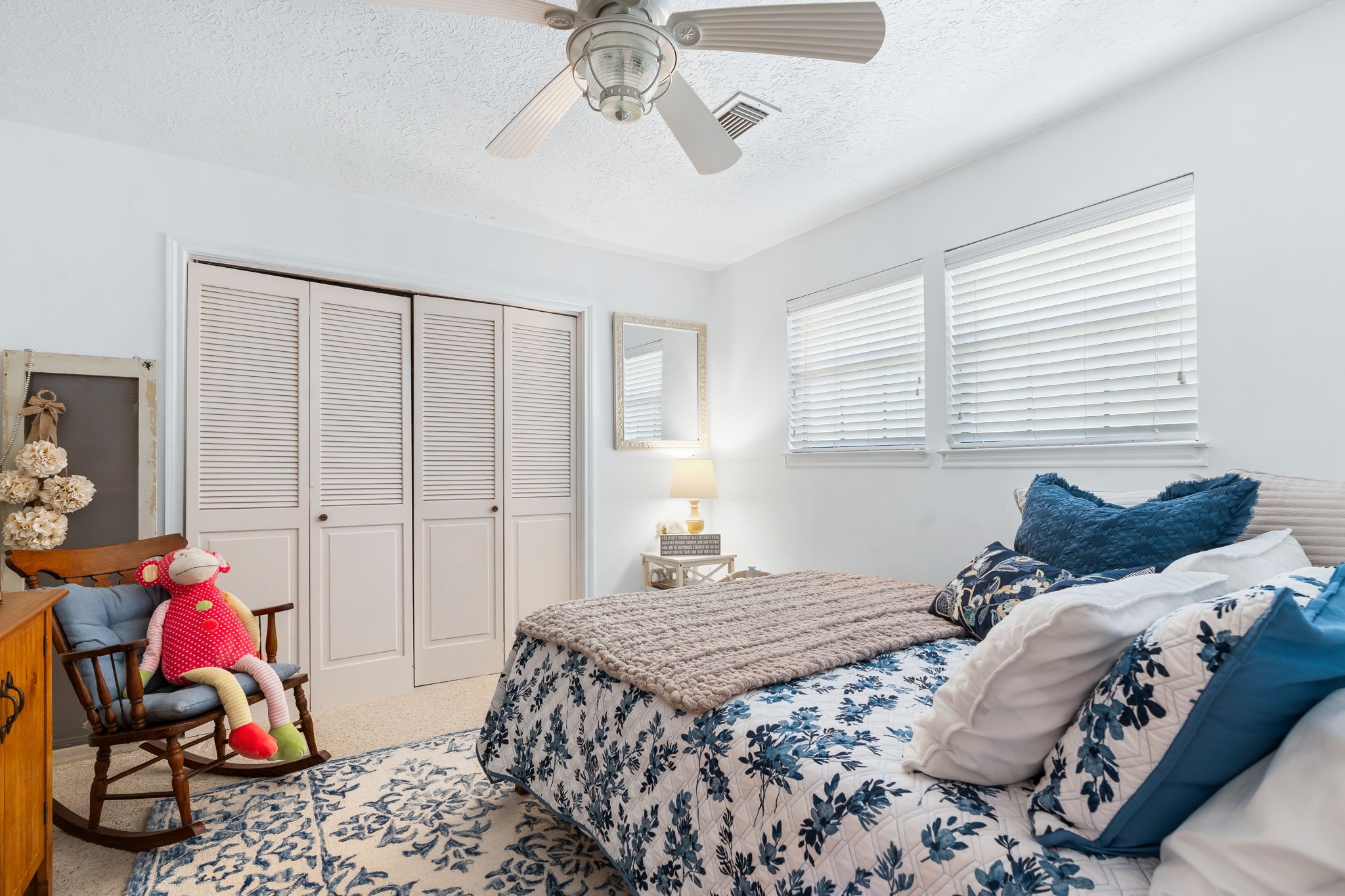 6971 Breezy Point Willis, TX 77318 - Photo 20 of 49 a bedroom with a bed and a window